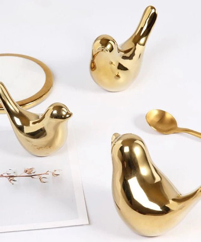 Figurine Little Bird dorée détails